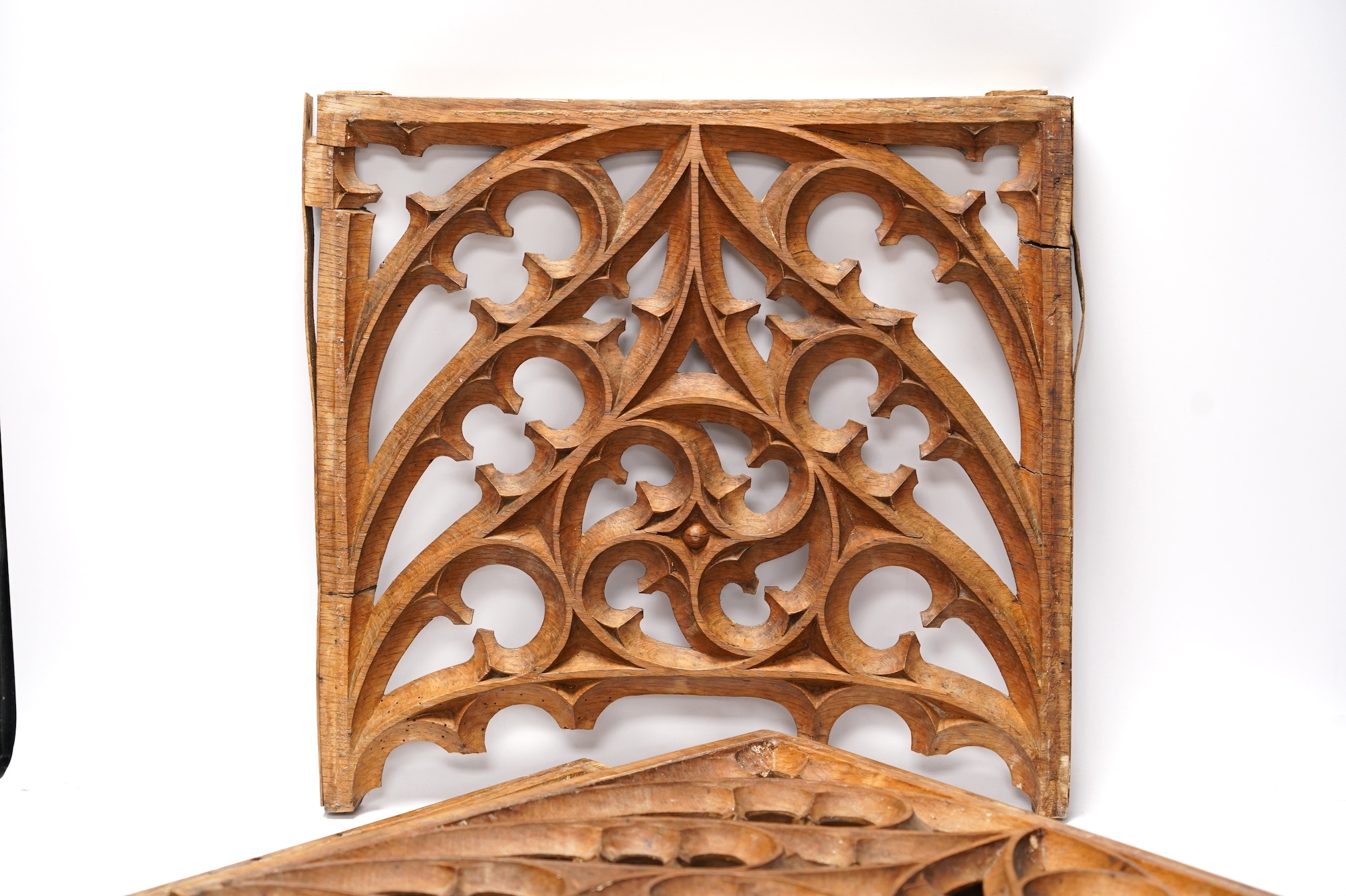 A set of three Victorian or earlier gothic carved oak tracery panels, 37cm high. Condition - fair to poor, losses and cracking
